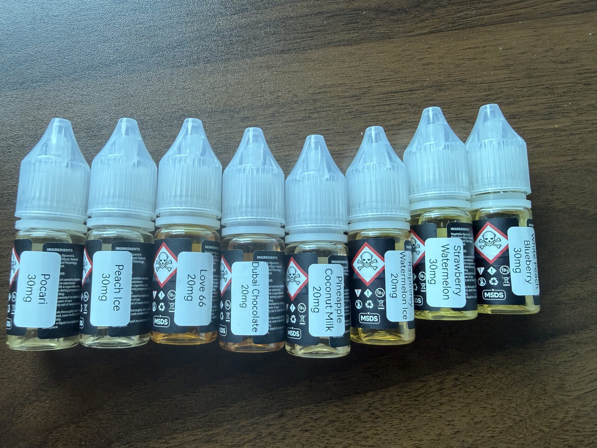 YTOO June 2026 e-juice flavor labels including Pocari, Peach Ice, Love 66, Dubai Chocolate, Pineapple Coconut Milk, Raspberry Watermelon Ice, Strawberry Watermelon, and White Peach Blueberry